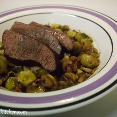 Venison loin with Brussels sprouts and chestnuts.